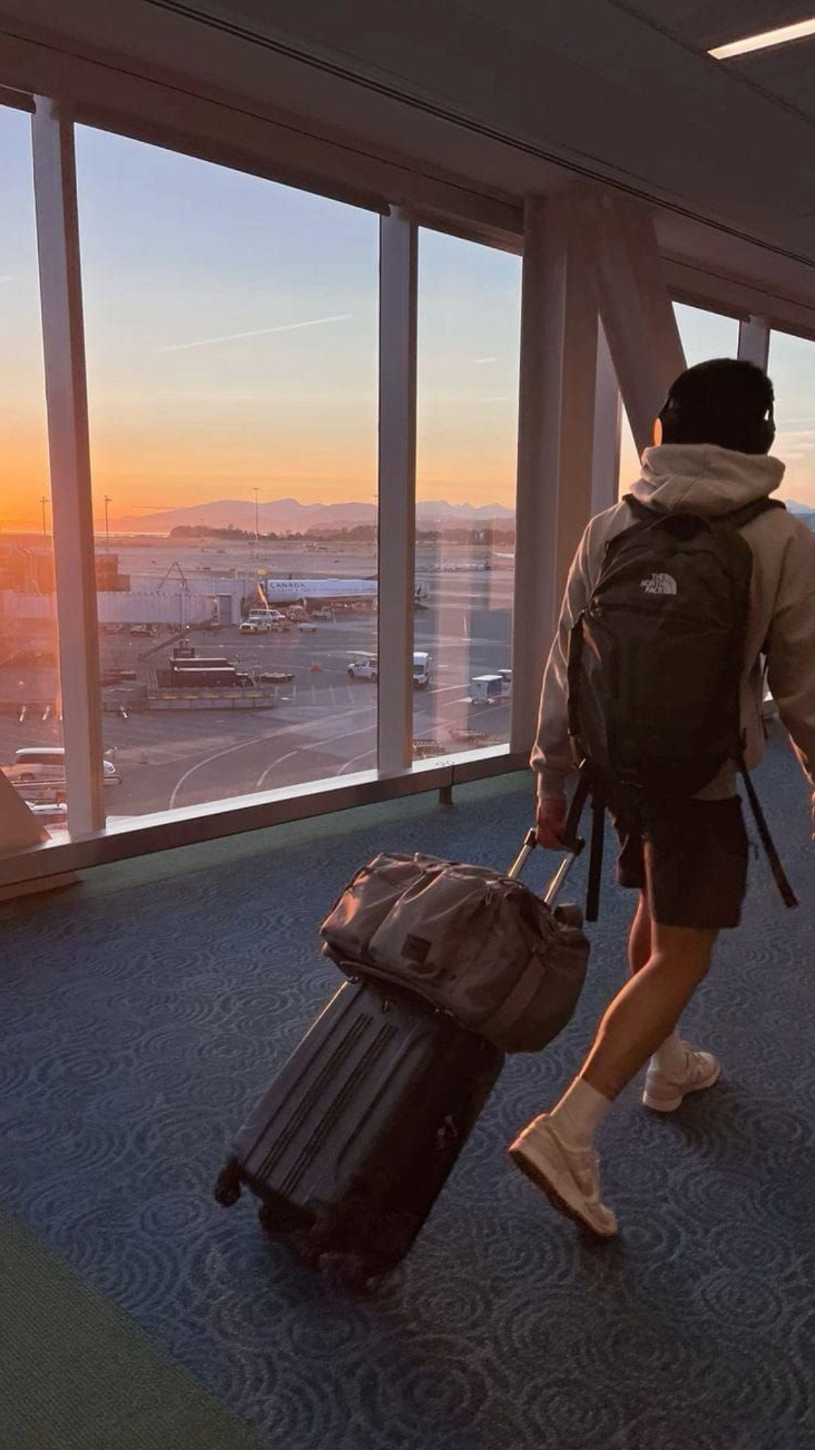 Walking through an airport with luggage